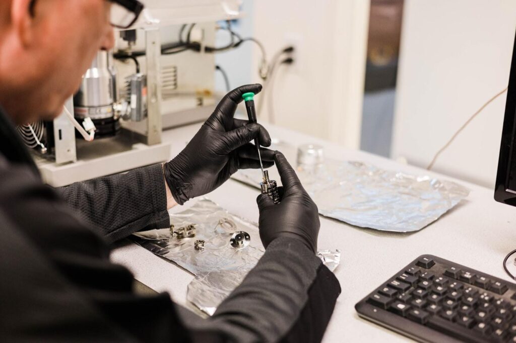 A man refurbishing lab equipment